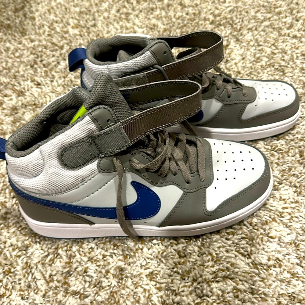 Gray mid top Nike sneaker
